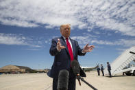 President Donald Trump speaks with reporters before boarding Air Force One as he departs Saturday, May 30, 2020, at Andrews Air Force Base, Md. Trump is en route to Kennedy Space Center for the SpaceX Falcon 9 Launch. (AP Photo/Alex Brandon)