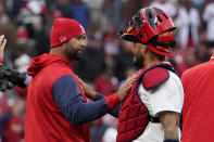 St. Louis Cardinals' Albert Pujols, left, and Yadier Molina celebrate a 9-0 victory over the Pittsburgh Pirates in a baseball game Thursday, April 7, 2022, in St. Louis. (AP Photo/Jeff Roberson)