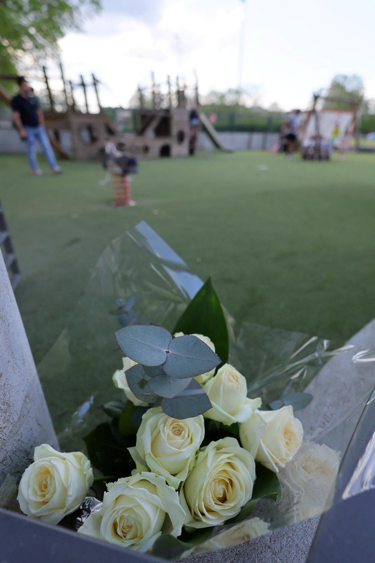 White roses are pictured at the children's playground (REUTERS)