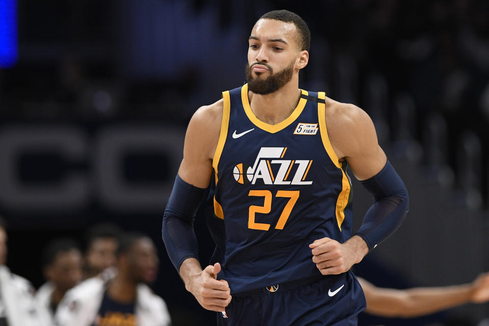 Utah Jazz center Rudy Gobert (27) runs on the court during the second half of an NBA basketball game against the Washington Wizards, Sunday, Jan. 12, 2020, in Washington. The Jazz won 127-116. (AP Photo/Nick Wass)