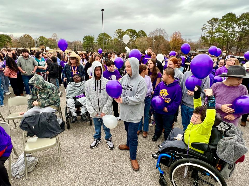 Central High School students and members of the Best Buddies program hold balloons set to release Nov. 17, 2023 during a special remembrance ceremony honoring the life and memory of Will Spiess.