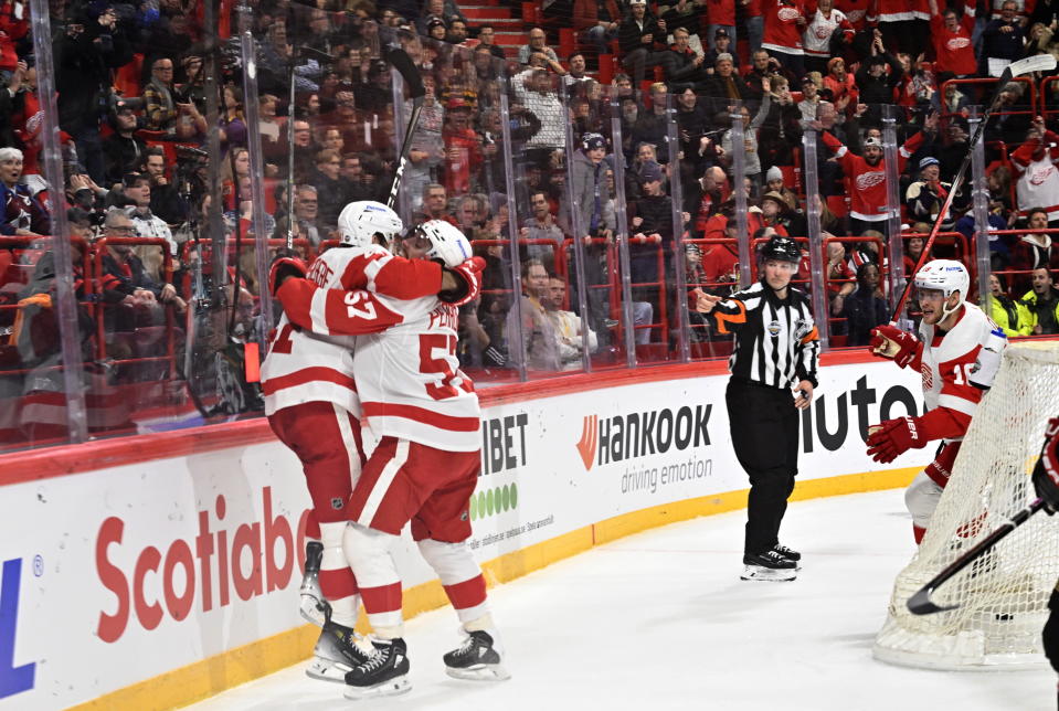 Detroit Red Wings celebrate the 4-4 goal scored by Shayne Gostisbehere during the NHL Global Series Sweden ice hockey match between Detroit Red Wings and Ottawa Senators at Avicii Arena in Stockholm, Sweden, Thursday, Nov. 16, 2023. (Henrik Montgomery/TT News Agency via AP)