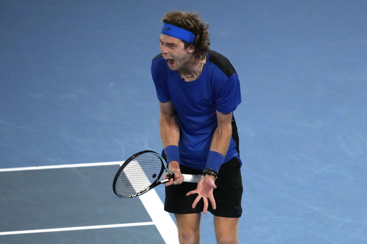 Andrey Rublev of Russia reacts after losing a point to Novak Djokovic of Serbia during their quarterfinal match at the Australian Open tennis championship in Melbourne, Australia, Wednesday, Jan. 25, 2023. (AP Photo/Ng Han Guan)