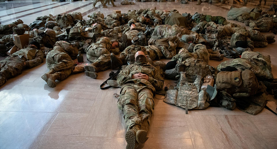 Soldiers lying on the floor. Source: AP