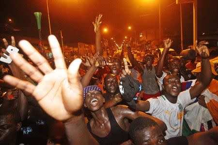 Fans of Ivory Coast team celebrate in a street of Abidjan the victory of their team in their African Nations Cup final against Ghana, February 8, 2015. REUTERS/Luc Gnago