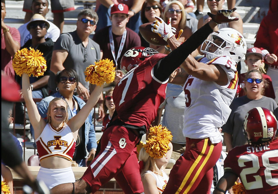 Iowa State wide receiver Allen Lazard (5) catches the game winning touchdown between Oklahoma cornerback Jordan Thomas (7) and safety Chanse Sylvie (28) in the fourth quarter of an NCAA college football game in Norman, Okla., Saturday, Oct. 7, 2017. Iowa State won 38-31. (AP Photo/Sue Ogrocki)