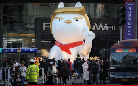 A dog sculpture in the style of Donald Trump outside a shopping mall in Taiyuan, December 2017 - Credit: VCG