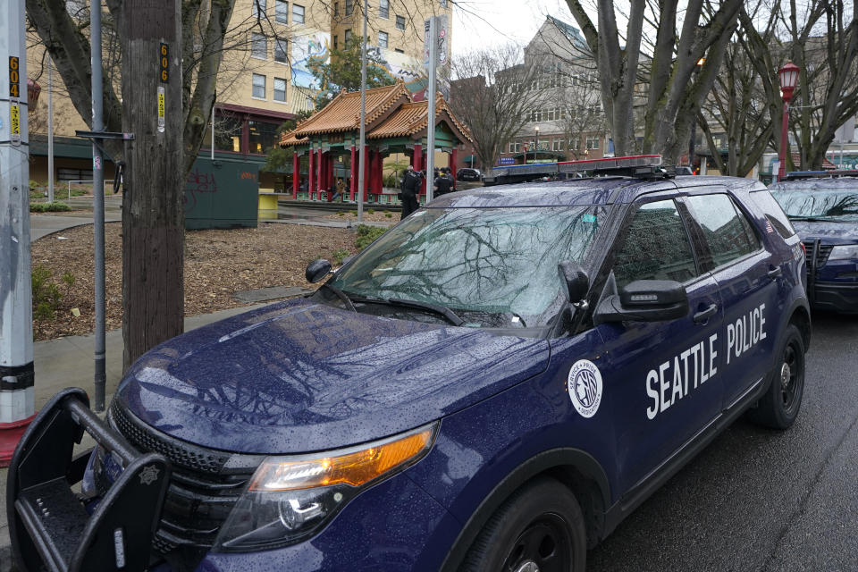 FILE - A Seattle Police Department vehicle sits parked at Hing Hay Park in the heart of Seattle's Chinatown-International District, March 18, 2021, as a community response unit of officers began their shift. The U.S. Justice Department and Seattle officials on Tuesday, March 28, 2023, asked a judge to end most federal oversight of the city's police department, saying its sustained, decade-long reform efforts are a model for cities around the country whose law enforcement agencies face federal civil rights investigations. (AP Photo/Ted S. Warren, File)