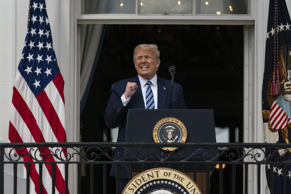 President Donald Trump speaks from the Blue Room Balcony of the White House to a crowd of supporters, Saturday, Oct. 10, 2020, in Washington. (AP Photo/Alex Brandon)