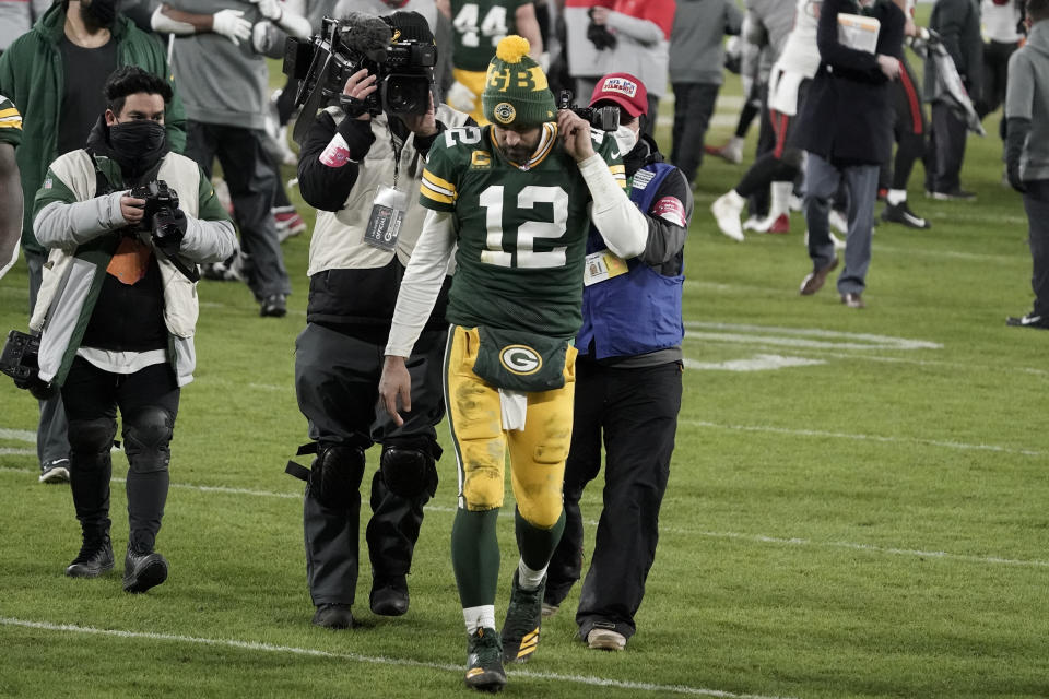 Green Bay Packers quarterback Aaron Rodgers (12) walks off the field after the NFC championship NFL football game against the Tampa Bay Buccaneers in Green Bay, Wis., Sunday, Jan. 24, 2021. The Buccaneers defeated the Packers 31-26 to advance to the Super Bowl. (AP Photo/Morry Gash)