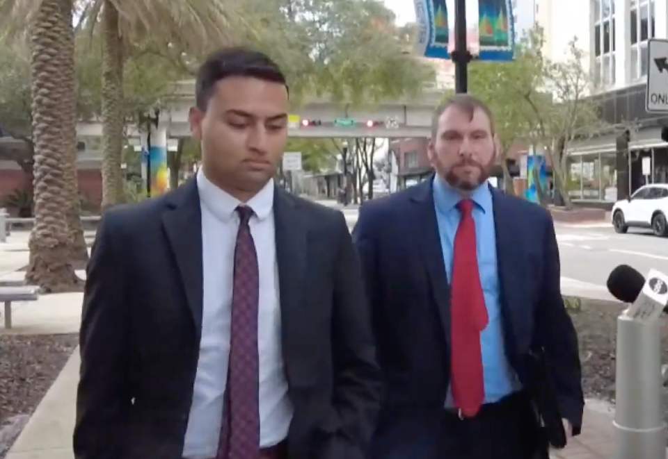 Former finance manager for the Jacksonville Jaguars, Amit Patel, left, and attorney Alex King leave the federal courthouse Thursday, Dec. 14, 2023, after pleading guilty to embezzling about $22 million from the team.