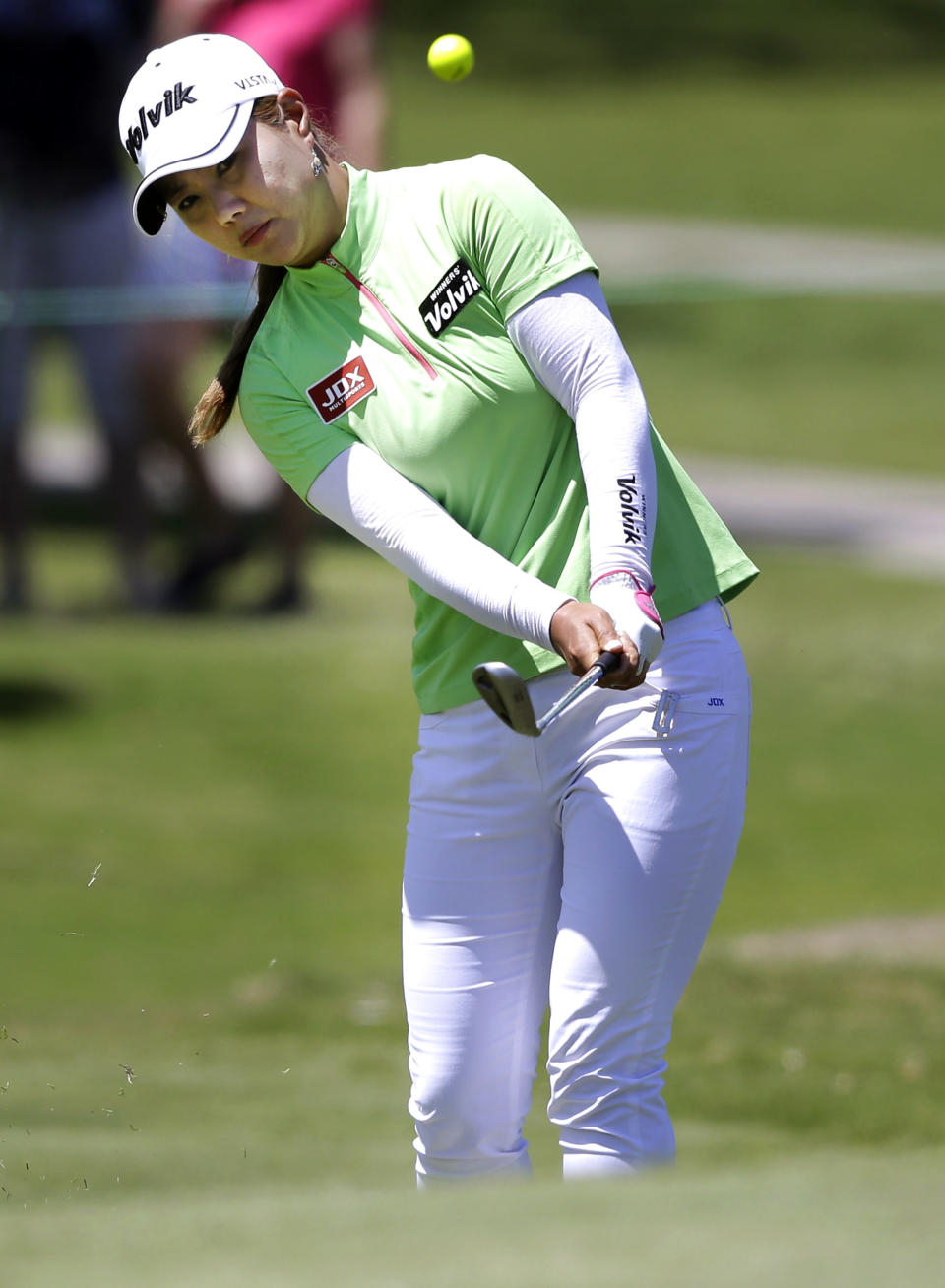 Meena Lee, of South Korea, chips onto the 10th hole during the third round of the North Texas LPGA Shootout golf tournament at the Las Colinas Country Club in Irving, Texas, Saturday, May 3, 2014. (AP Photo/LM Otero)