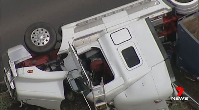 The truck driver was taken to hospital with an arm injury. Source: 7 News