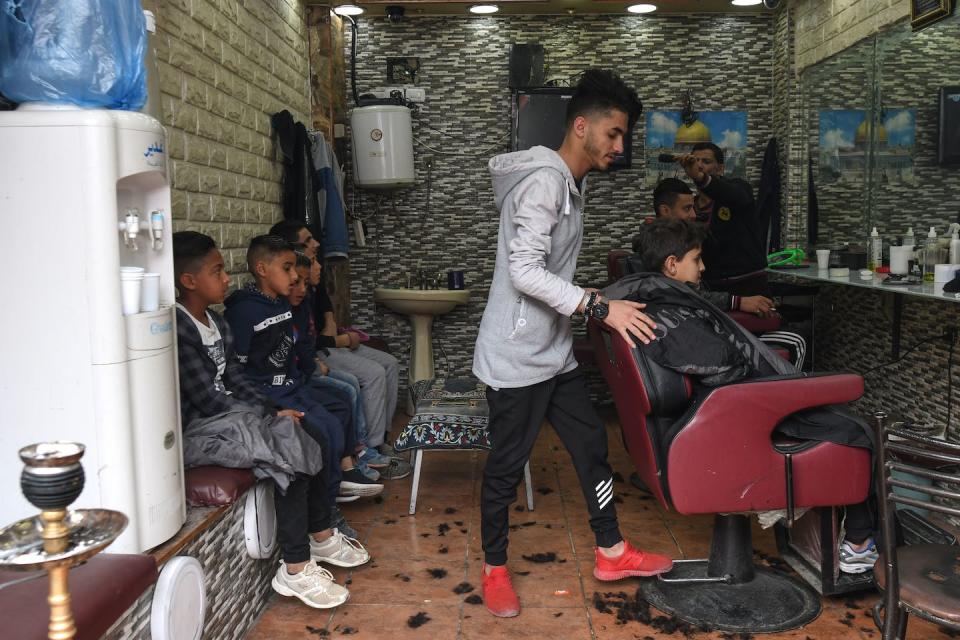 A local barbershop inside Al-Wehdat Palestinian refugee camp in Amman. <a href="https://www.gettyimages.com/detail/news-photo/local-barber-shop-inside-al-wehdat-palestinian-refugee-camp-news-photo/1093054342?adppopup=true" rel="nofollow noopener" target="_blank" data-ylk="slk:Artur Widak/NurPhoto via Getty Images;elm:context_link;itc:0;sec:content-canvas" class="link ">Artur Widak/NurPhoto via Getty Images</a>