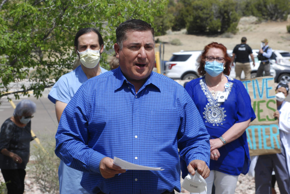 In this May 8, 2020, photo, New Mexico state Sen. George Munoz, D-Gallup, joins medical staff from Rehoboth McKinley Christian Hospital in a protest over working conditions and depleted staff in Gallup, N.M. (AP Photo/Morgan Lee)