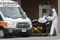 A resident is removed from the Gallatin Center for Rehabilitation and Healing, Monday, March 30, 2020, in Gallatin, Tenn. Multiple people tested positive for the coronavirus at the facility Friday. Tennessee Gov. Bill Lee issued a statewide "safer-at-home" order on Monday to help stem the state's rapid spread of coronavirus, mandating the closure of all nonessential businesses while urging residents to remain at home whenever possible for the next two weeks. (AP Photo/Mark Humphrey)