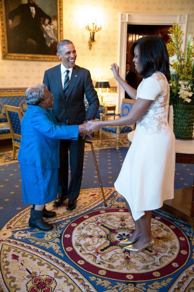 Obama watches the first lady dance with 106-year-old Virginia McLaurin in the Blue Room of the White House prior to a reception celebrating African American History Month on Feb. 18.