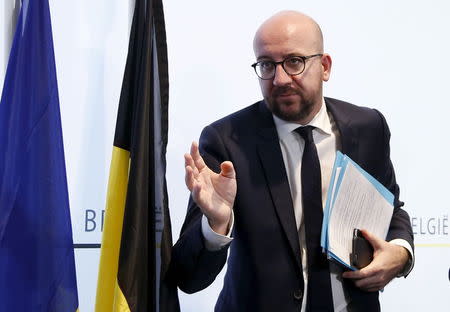Belgium's Prime Minister Charles Michel leaves a news conference in Brussels, November 22, 2015, after security was tightened in Belgium following the fatal attacks in Paris. REUTERS/Francois Lenoir