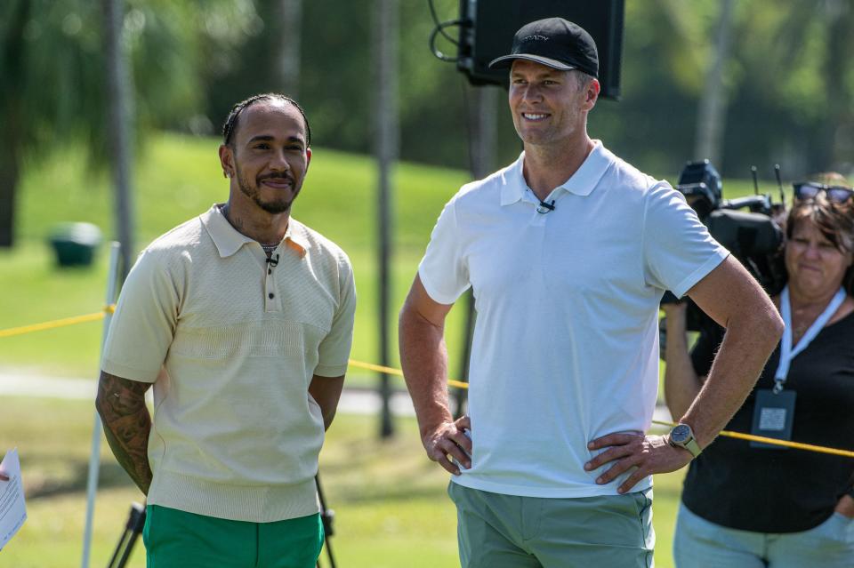 Mercedes' British driver Lewis Hamilton (pictured left) and and NFL quarterback Tom Brady (picutred right) attend the Big Pilot Charity Challenge at the Miami Beach Golf Club.