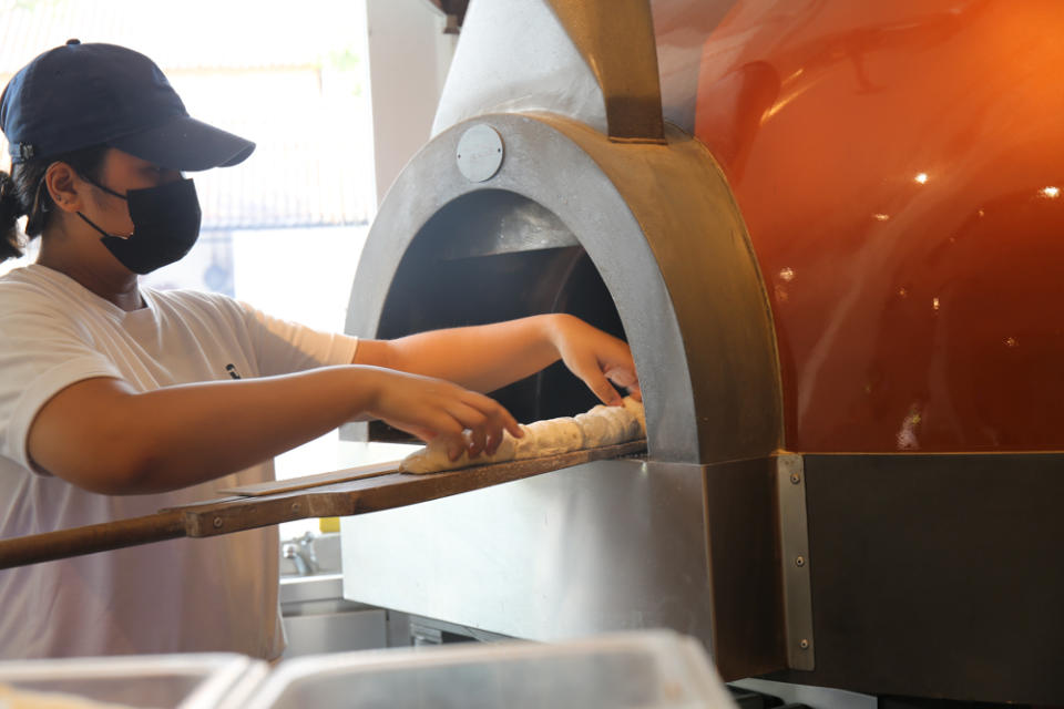 image of stirato being put into the oven