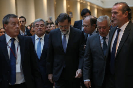 Spain's Prime Minister Mariano Rajoy (C) arrives to take part in a debate at the upper house Senate in Madrid, Spain, October 27, 2017. REUTERS/Susana Vera