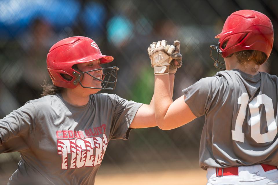 Cedar Bluff’s Haley Allen (11) celebrates after scoring a run during the AHSAA softball state championship series at Choccolocco Park  in Oxford, Ala., on Friday, May 20, 2022.  