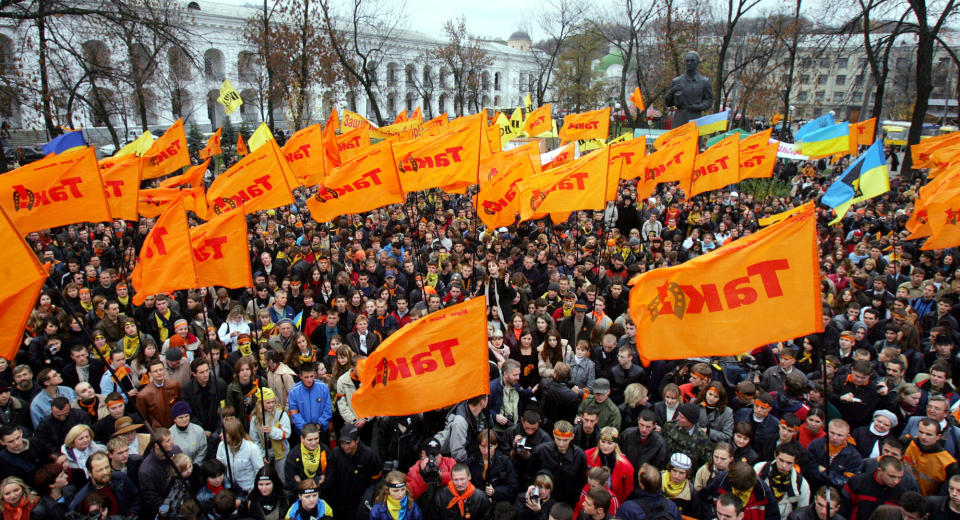 FILE - In this Nov. 2, 2004, file photo, Viktor Yushchenko supporters and members of the pro-democracy student group Pora protest during a rally in Kiev. Orange was the campaign color of Ukraine’s pro-Western presidential candidate Yushchenko in the 2004 presidential election. His supporters challenged the victory of his pro-Russia rival in the runoff vote and took to the streets in what was dubbed the Orange Revolution. (AP Photo/Ivan Sekretarev, File)