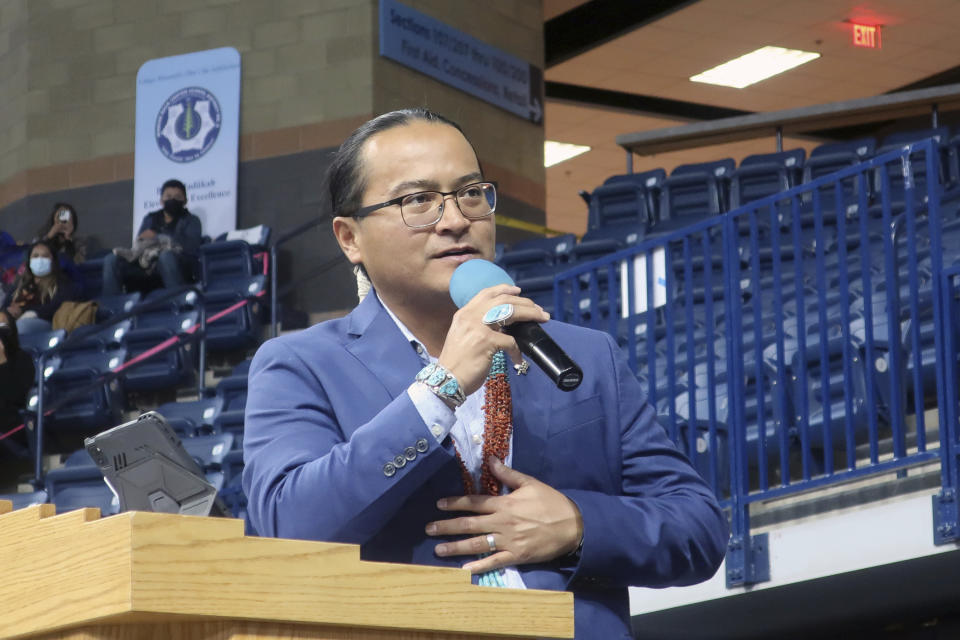 Navajo Nation President Buu Nygren addresses a crowd at an indoor sports arena, Tuesday, Jan. 10, 2023, in Fort Defiance, Ariz. Nygren was sworn in as president and is the youngest person to serve in that position. His vice president, Richelle Montoya, is the first woman in that job. (AP Photo/Felicia Fonseca)