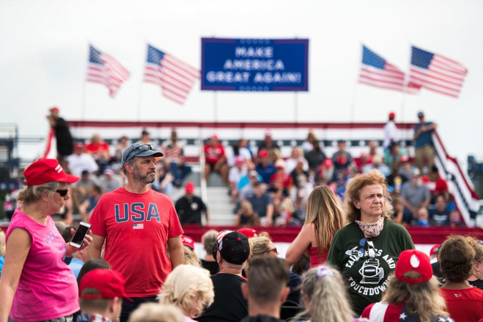 People wait for the arrival of President Donald Trump before a campaign rally at Smith Reynolds Airport on September 8, 2020 in Winston Salem, North Carolina.