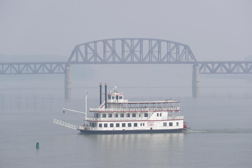 The Mary M. Miller steamboat on the Ohio River is obscured by smoke from the Canadian wildfires that have created a haze in downtown Louisville, Ky. on June 28, 2023.