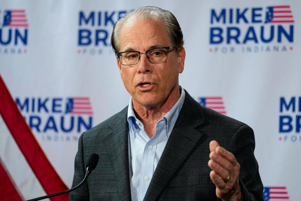 U.S. Sen. Mike Braun, R-Ind., announces in Indianapolis, Monday, Dec. 12, 2022 that he will for Indiana governor in 2024. Braun will face Indiana Lt. Gov. Suzanne Crouch for the Republican nomination. (AP Photo/Michael Conroy) ORG XMIT: INMC103