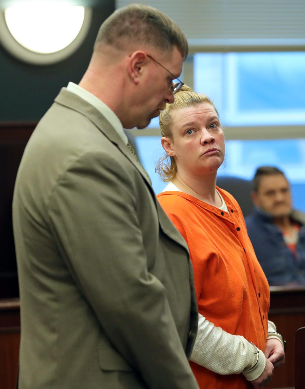 Ashley Archer, 37, looks to her attorney Jonathan Tucker after being sentenced in Portage County Court of Common Pleas Monday morning to four years in prison by Judge Laurie Pittman for allowing her 2-year-old daughter to overdose on meth last August.