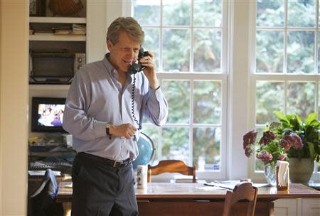 Robert Shiller, one of three American scientists who won the 2013 economics Nobel prize, speaks on the phone at his home in New Haven, Connecticut Monday October 14, 2013. REUTERS/ Michelle McLoughlin