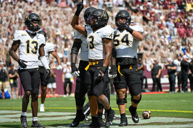 Appalachian State running back Ahmani Marshall (3) celebrates his first-half rushing touchdown against Texas A&amp;M on Saturday. (Ken Murray/Icon Sportswire via Getty Images)