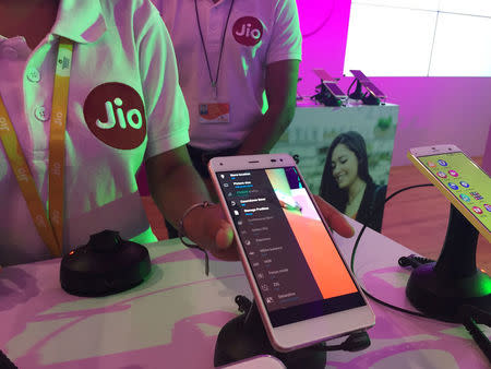 A Reliance employee demonstrates Jio LYF phone at their headquarters on the outskirts of Mumbai, India, June 1, 2016. REUTERS/Clara Ferreira Marques