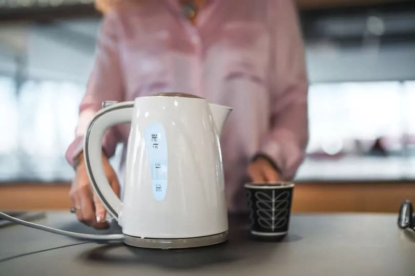 woman boiling kettle