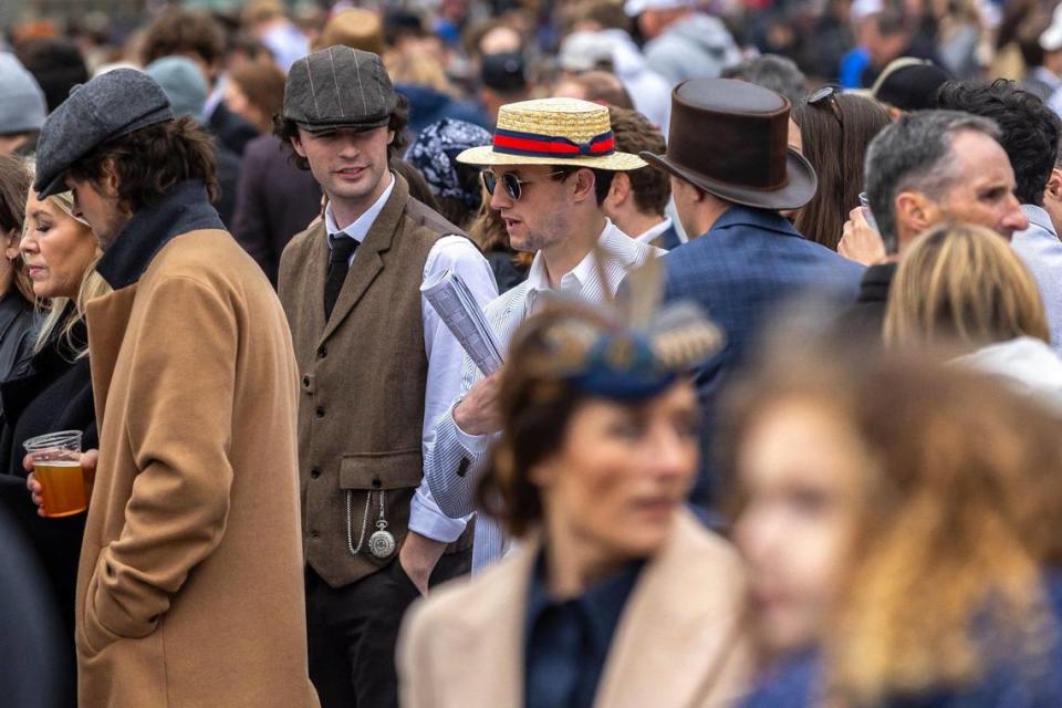 Spectators wait for the start of a race on opening day at Keeneland on Friday. Ryan C. Hermens/rhermens@herald-leader.com