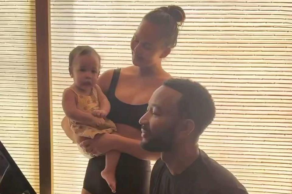 <p>Chrissy Teigen Instagram</p> John Legend singing to his daughter Esti as Chrissy Teigen holds her 