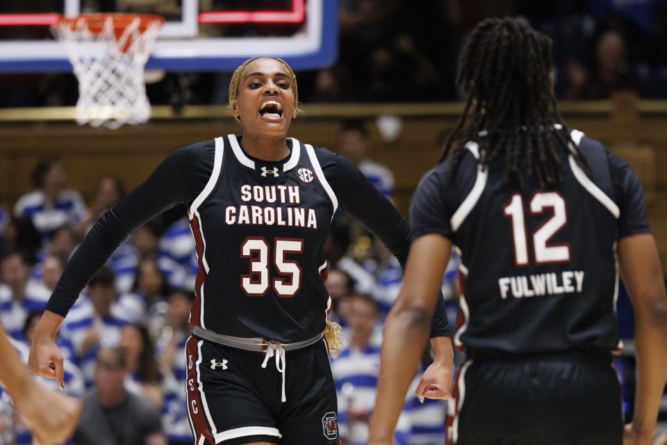 South Carolina's Sakima Walker and MiLaysia Fulwiley celebrate after a play during the first half against Duke in Durham, North Carolina, on Sunday. (AP Photo/Ben McKeown)