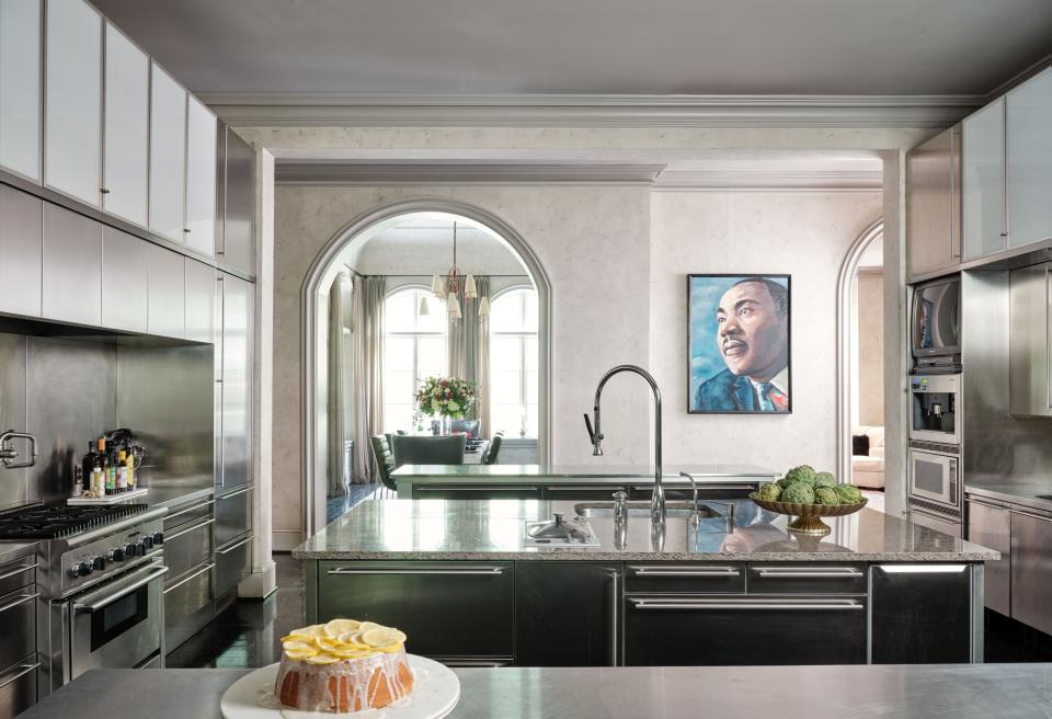 The kitchen has three islands and countless refrigerator drawers for vegetables, fruit, meat, and whatever else Gibson’s chef plans to prepare. “I entertain a lot,” the actor says. A painting of Martin Luther King Jr. by Kadir Nelson (best known for his New Yorker magazine covers) hangs prominently between two archways.