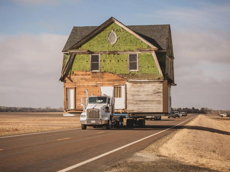 The Flores hired a house lifting company to get their home to its new location.