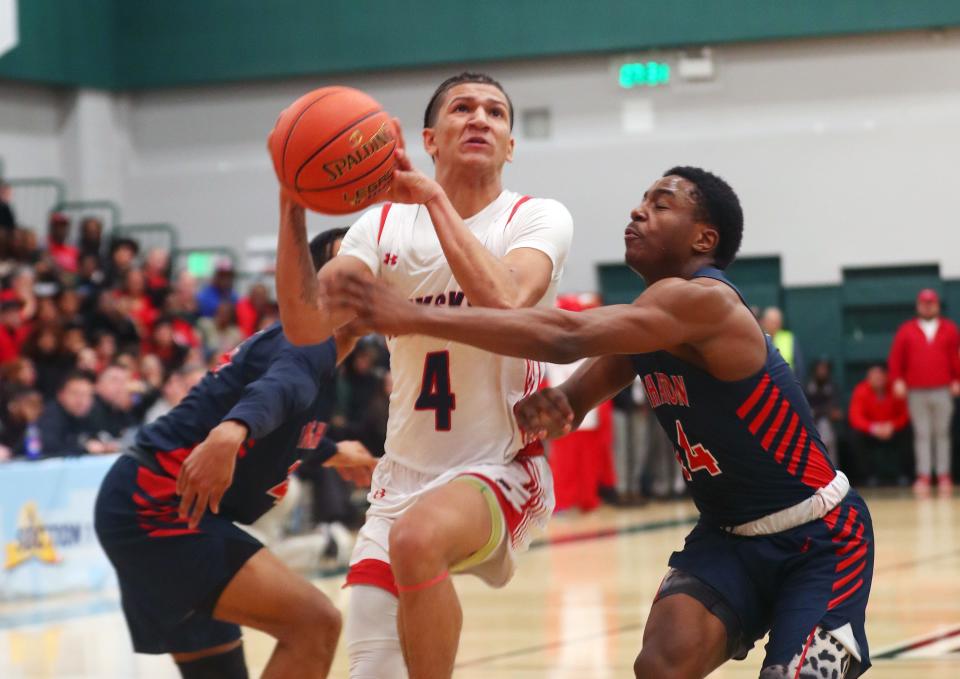 Peekskill's Isaiah Crawford (4) drives to the basket against Binghamton during the state Class AA subregional playoff game at Yorktown High School March 6, 2024. Peekskill won the game 53-52.