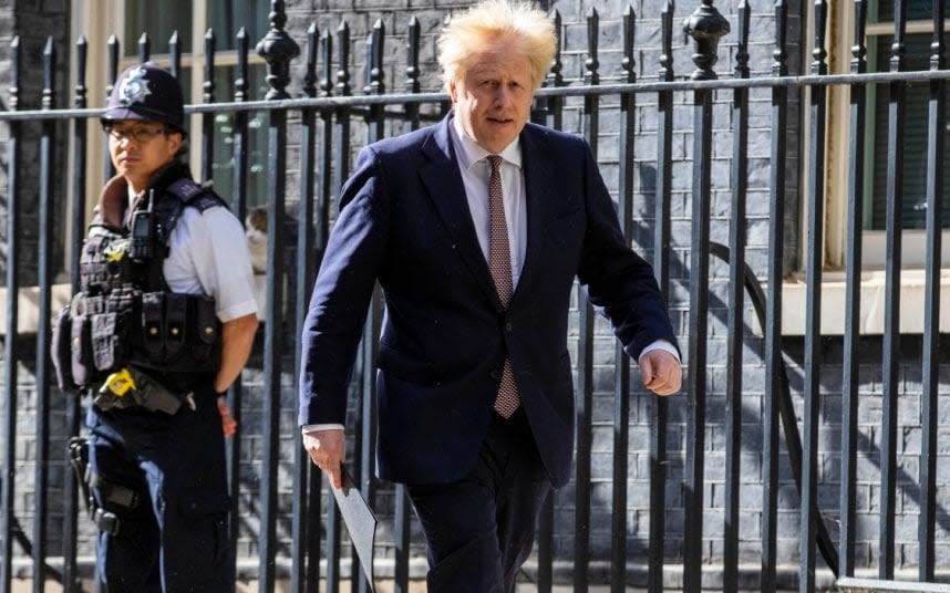 Boris Johnson leaves Number 10 Downing Street to attend last night's press conference  - Jamie Lorriman for The Telegraph 