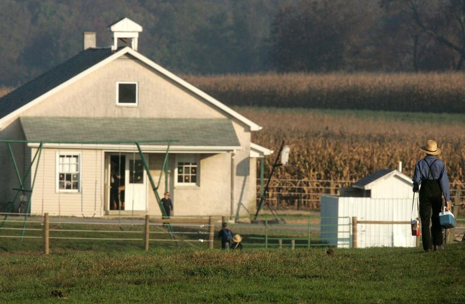 A young Amish boy walks to a school in Pennsylvania in 2006.