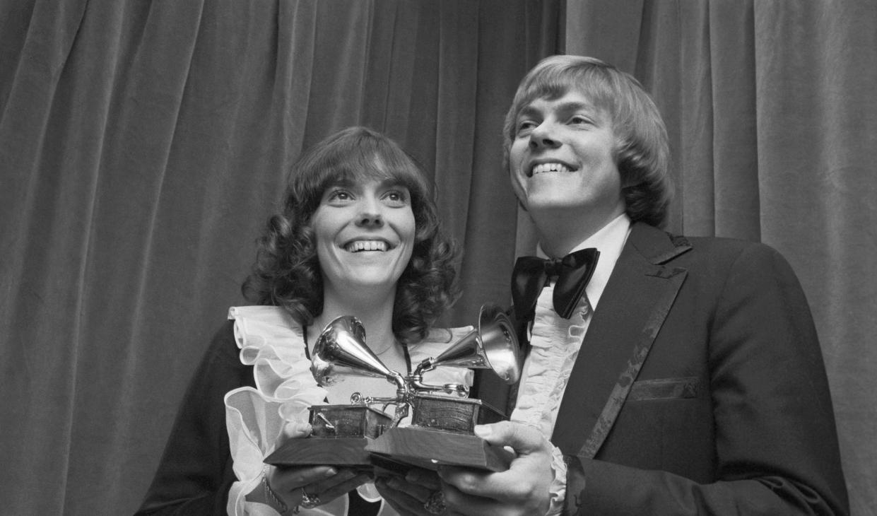 (Original Caption) Downey, California: Pop singer Karen Carpenter who recorded a string of hit songs with her brother Richard, died 02/04/83, hospital officials said. She was 32. The Carpenters are shown here with a Grammy award in 1972.