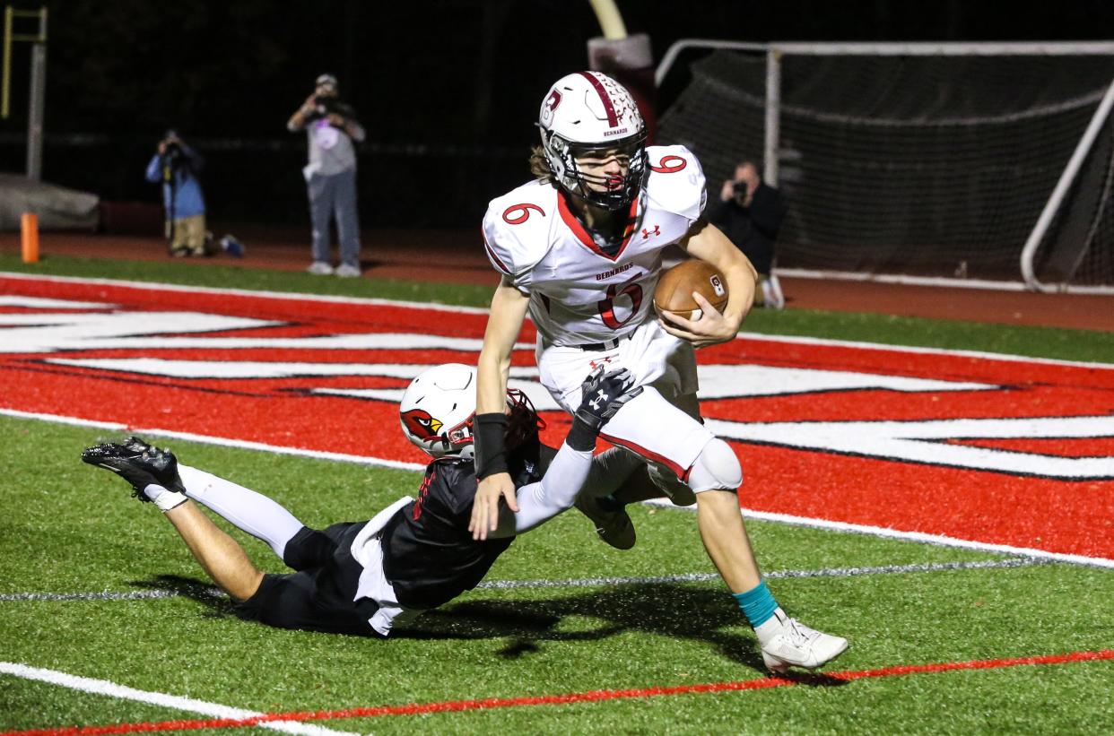 Bernards' Connor Laverty runs the ball as Westwood's Joe Klein defends during the first half of the NJSIAA Group 2 State Semifinals at Westwood High School on November 17, 2023.