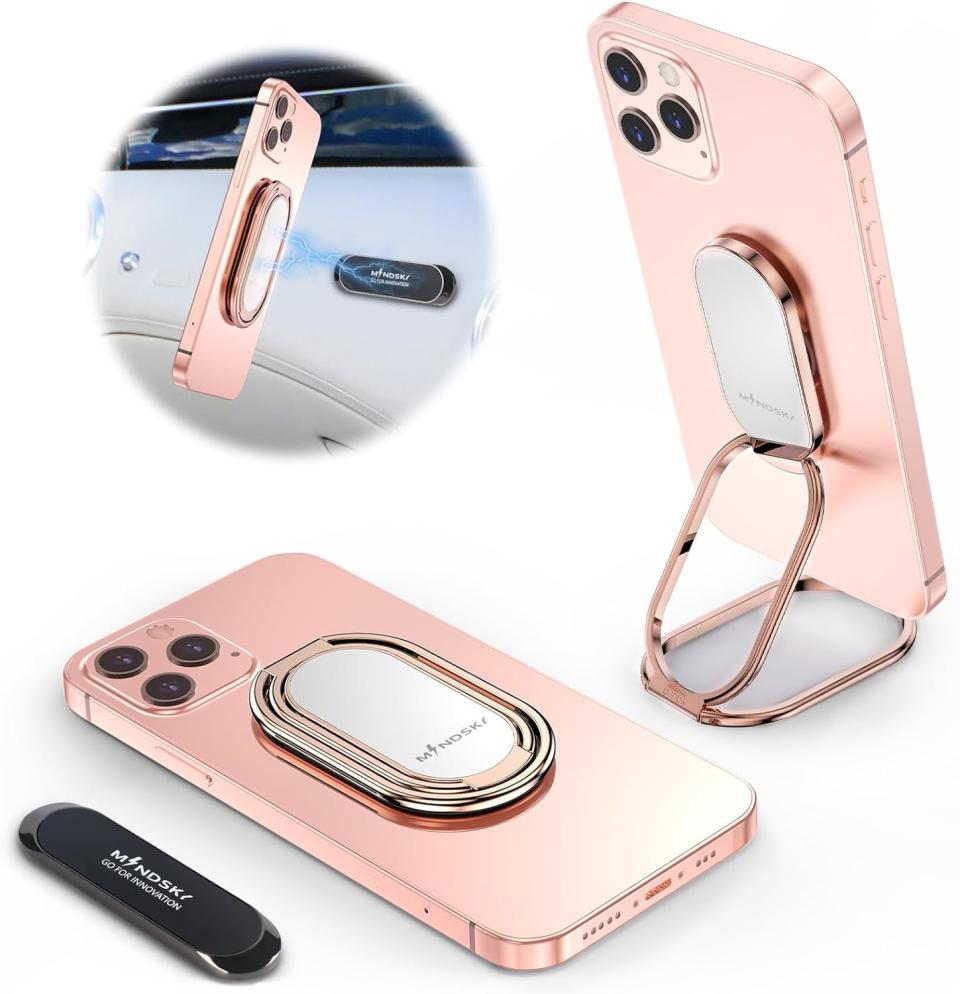rose gold metal phone ring holder on pink phone