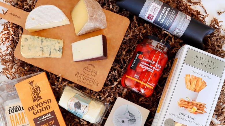assortment of cheeses and gourmet snacks