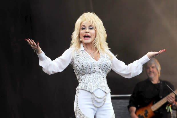 Dolly Parton performs on the Pyramid stage during Day 3 of the Glastonbury Festival at Worthy Farm in Pilton on June 29, 2014.<p><a href="https://www.gettyimages.com/detail/1253625274" rel="nofollow noopener" target="_blank" data-ylk="slk:Jim Dyson/Getty Images;elm:context_link;itc:0;sec:content-canvas" class="link ">Jim Dyson/Getty Images</a></p>