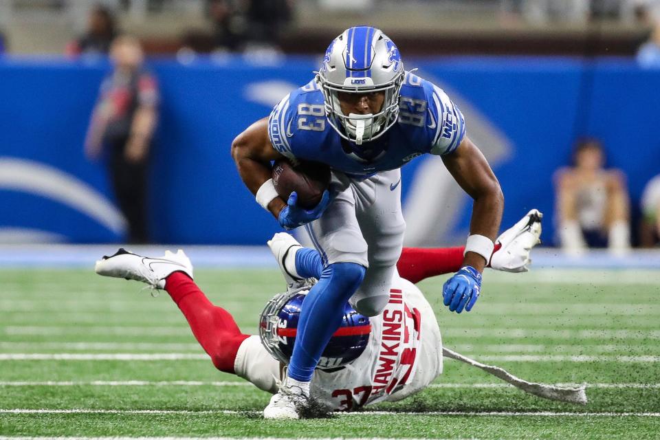 Detroit Lions wide receiver Dylan Drummond (83) makes a catch against New York Giants cornerback Tre Hawkins III (37) during the first half of a preseason game at Ford Field in Detroit on Friday, Aug. 11, 2023.